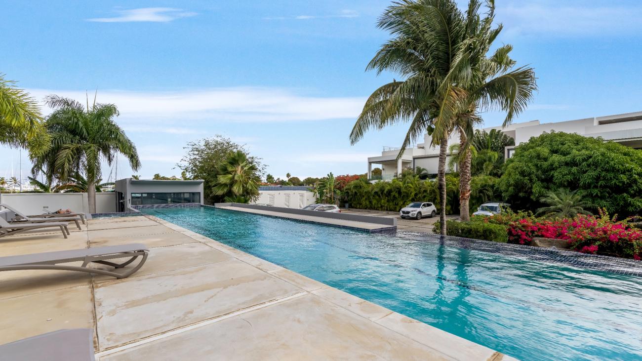 Luxury 3 bedrooms condo for sale in St Maarten Las Brisas. Waterfront. Swimming pool. Gym. Boat slip