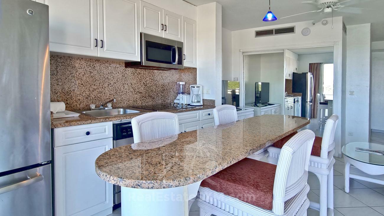 St Maarten: 1 bedroom apartment for sale 8th floor Sapphire Hotel Cupecoy. Lagoon View. (386)