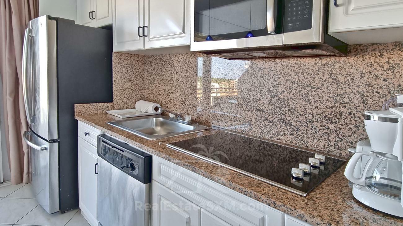 St Maarten: 1 bedroom apartment for sale 8th floor Sapphire Hotel Cupecoy. Lagoon View. (386)