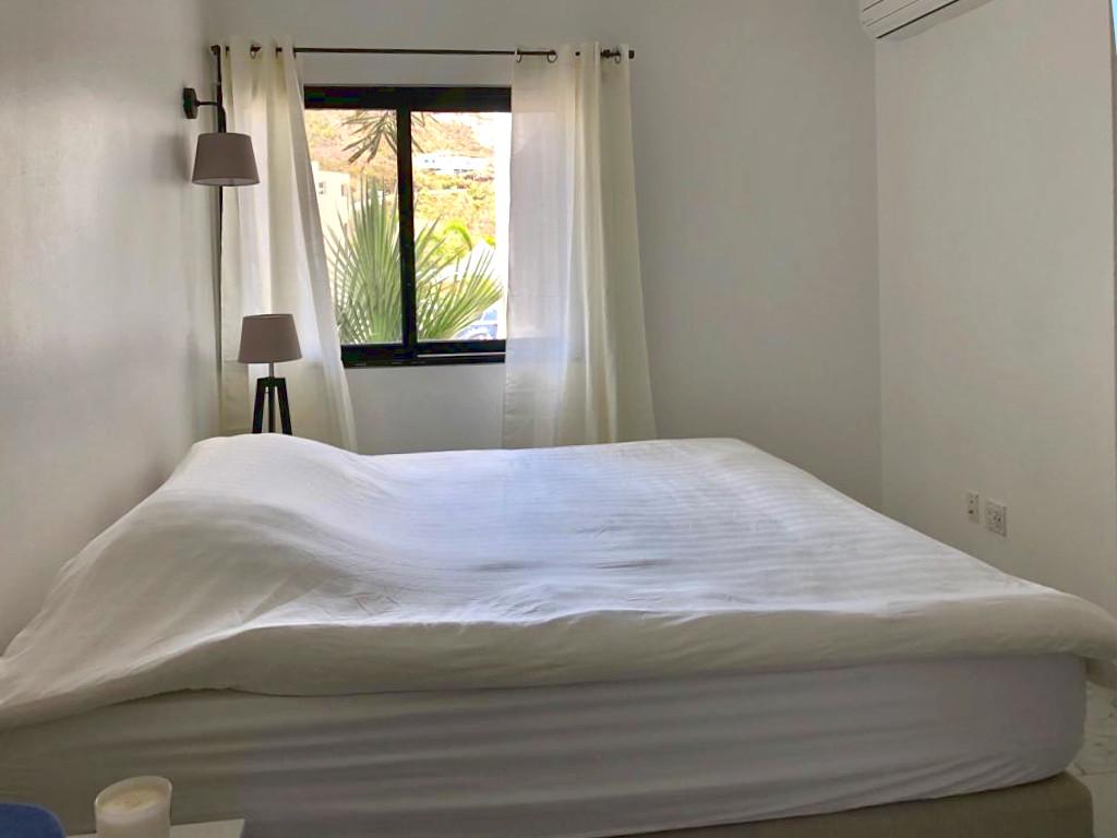 Home for rent St Maarten, 2BR modern condo in Guana Bay. Ocean and St Barts view. Gated. Vanina Res.