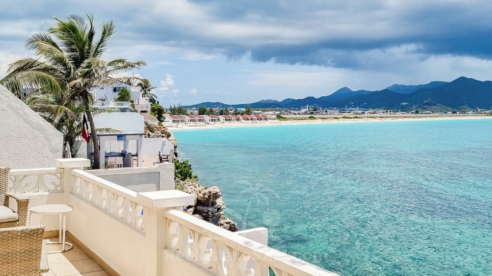 Waterfront Caribbean Villa for sale St Maarten, Beacon Hill. 2 bedrooms + Studio. Beach view. Boats