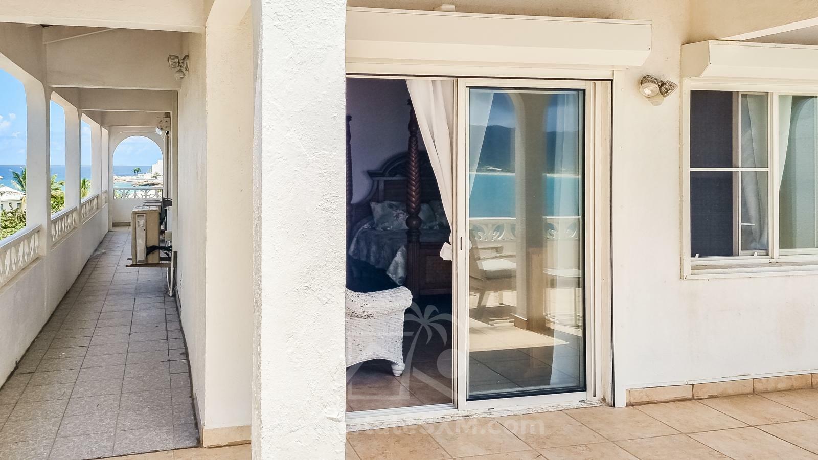 Waterfront Caribbean Villa for sale St Maarten, Beacon Hill. 2 bedrooms + Studio. Beach view. Boats
