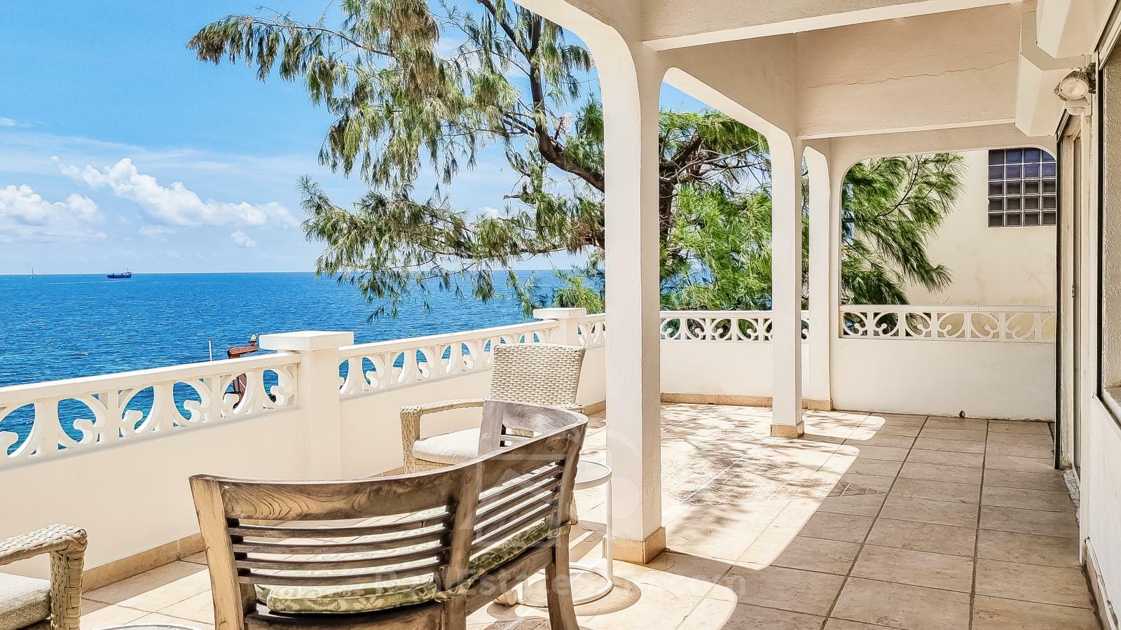 Waterfront Caribbean Villa for sale St Maarten, Beacon Hill. 2 bedrooms + Studio. Beach view. Boats