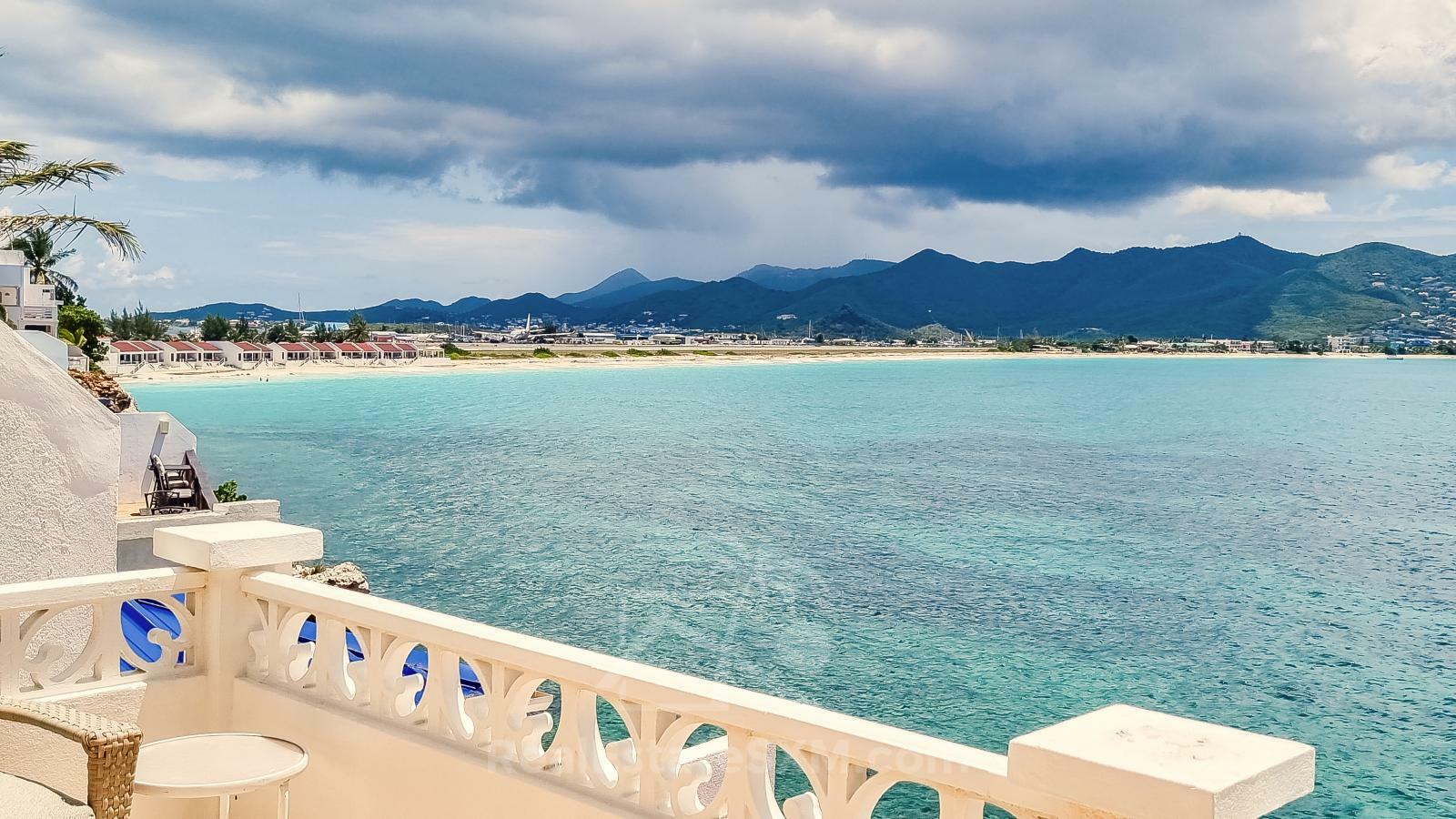 Waterfront Caribbean Villa for sale St Maarten, Beacon Hill. 2 bedrooms + Studio. Beach view. Boats
