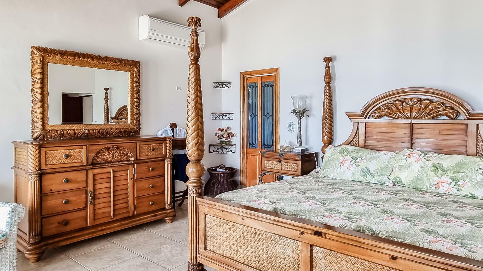 Waterfront Caribbean Villa for sale St Maarten, Beacon Hill. 2 bedrooms + Studio. Beach view. Boats