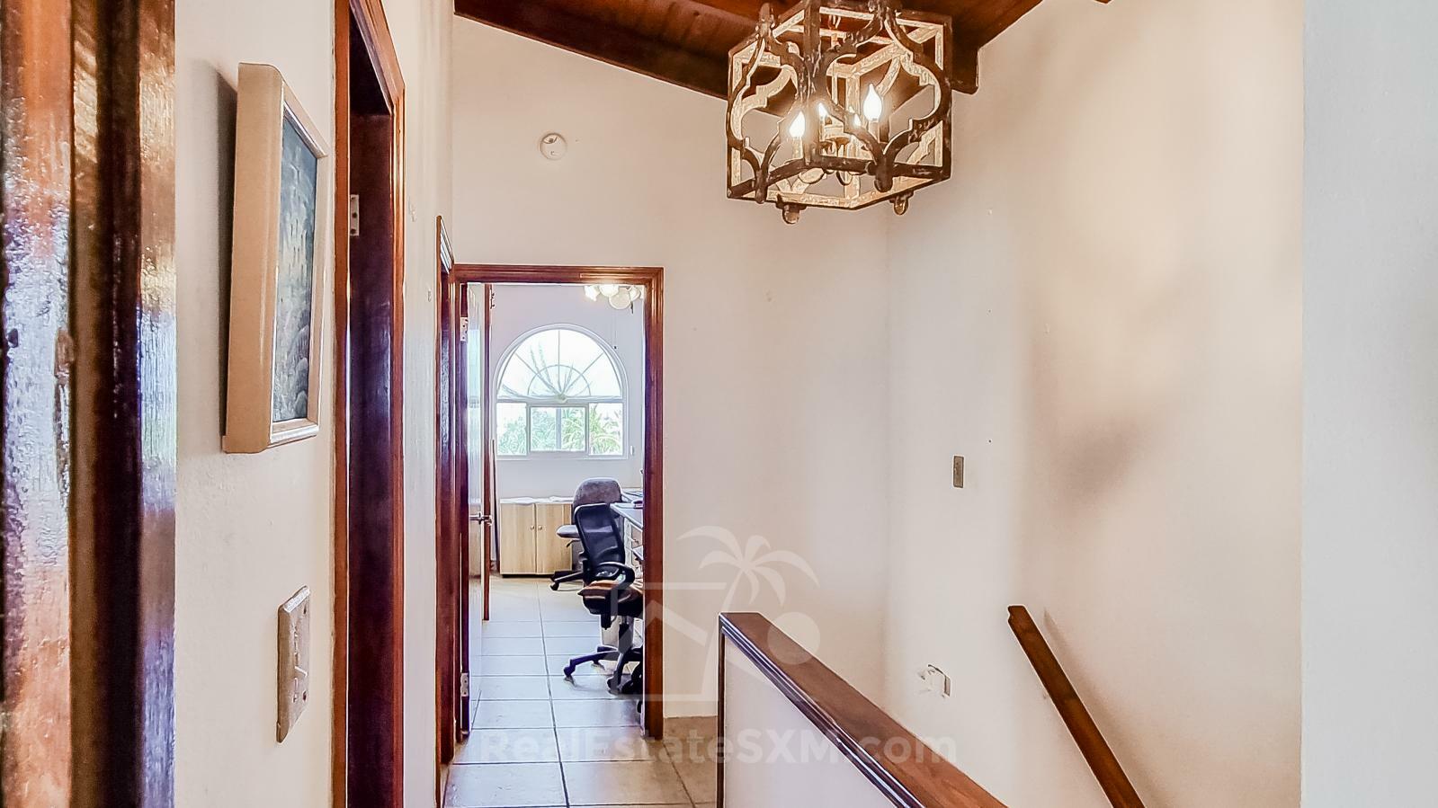 Waterfront Caribbean Villa for sale St Maarten, Beacon Hill. 2 bedrooms + Studio. Beach view. Boats