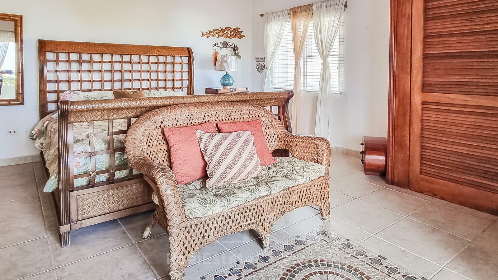 Waterfront Caribbean Villa for sale St Maarten, Beacon Hill. 2 bedrooms + Studio. Beach view. Boats