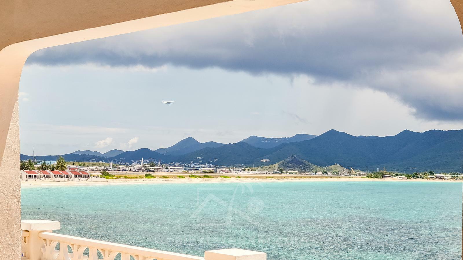 Waterfront Caribbean Villa for sale St Maarten, Beacon Hill. 2 bedrooms + Studio. Beach view. Boats