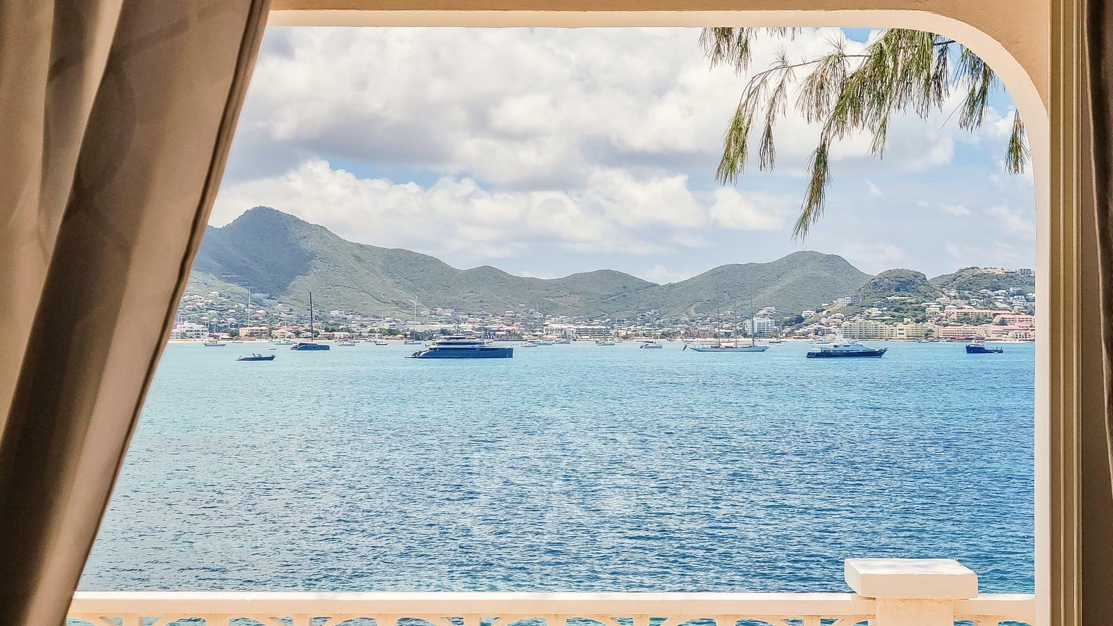 Waterfront Caribbean Villa for sale St Maarten, Beacon Hill. 2 bedrooms + Studio. Beach view. Boats