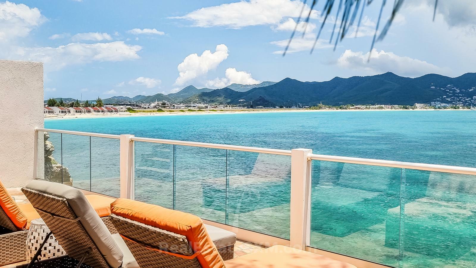 Waterfront Caribbean Villa for sale St Maarten, Beacon Hill. 2 bedrooms + Studio. Beach view. Boats
