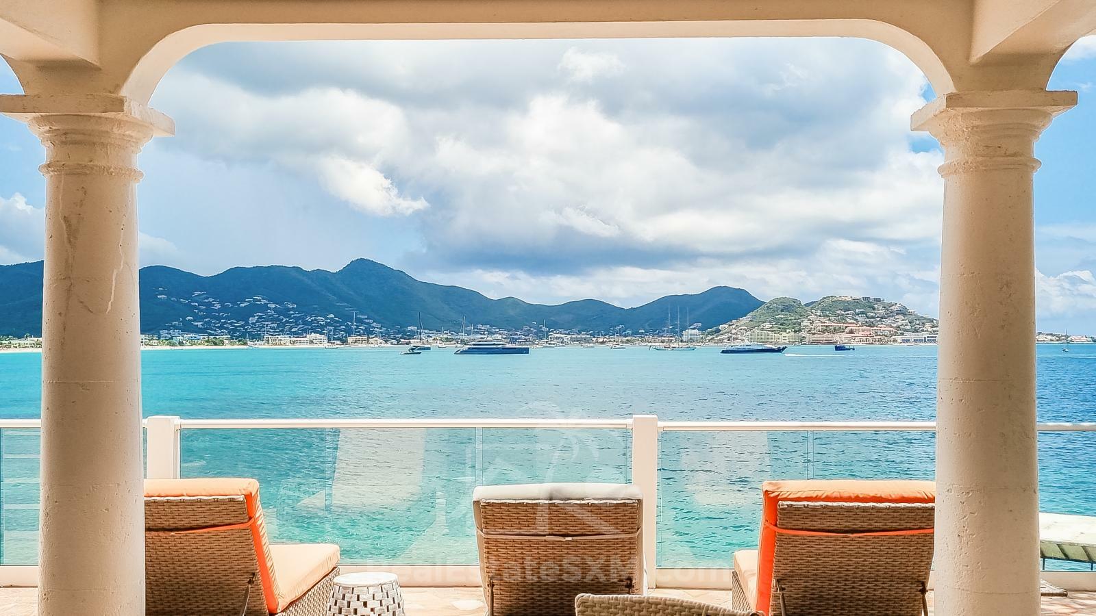Waterfront Caribbean Villa for sale St Maarten, Beacon Hill. 2 bedrooms + Studio. Beach view. Boats