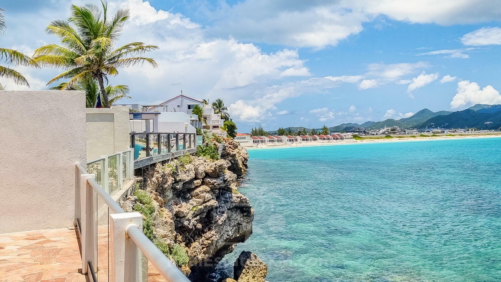 Waterfront Caribbean Villa for sale St Maarten, Beacon Hill. 2 bedrooms + Studio. Beach view. Boats