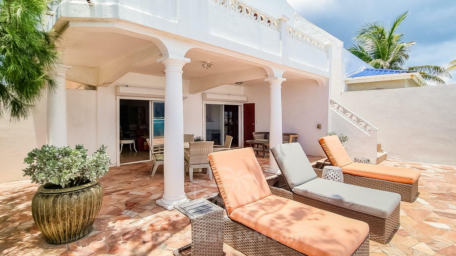 Waterfront Caribbean Villa for sale St Maarten, Beacon Hill. 2 bedrooms + Studio. Beach view. Boats