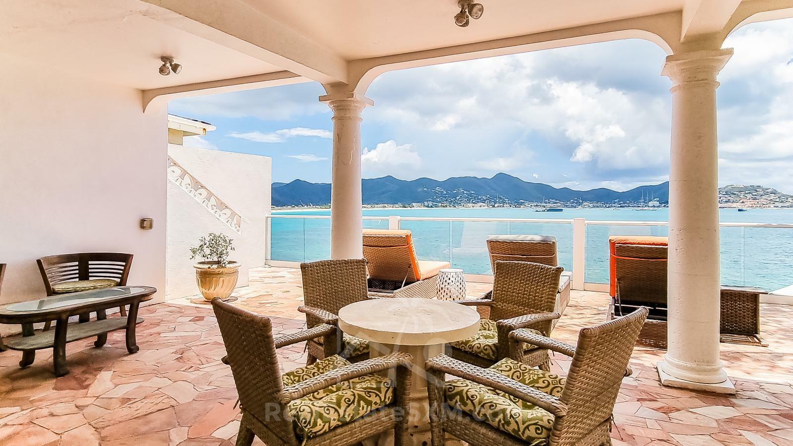 Waterfront Caribbean Villa for sale St Maarten, Beacon Hill. 2 bedrooms + Studio. Beach view. Boats