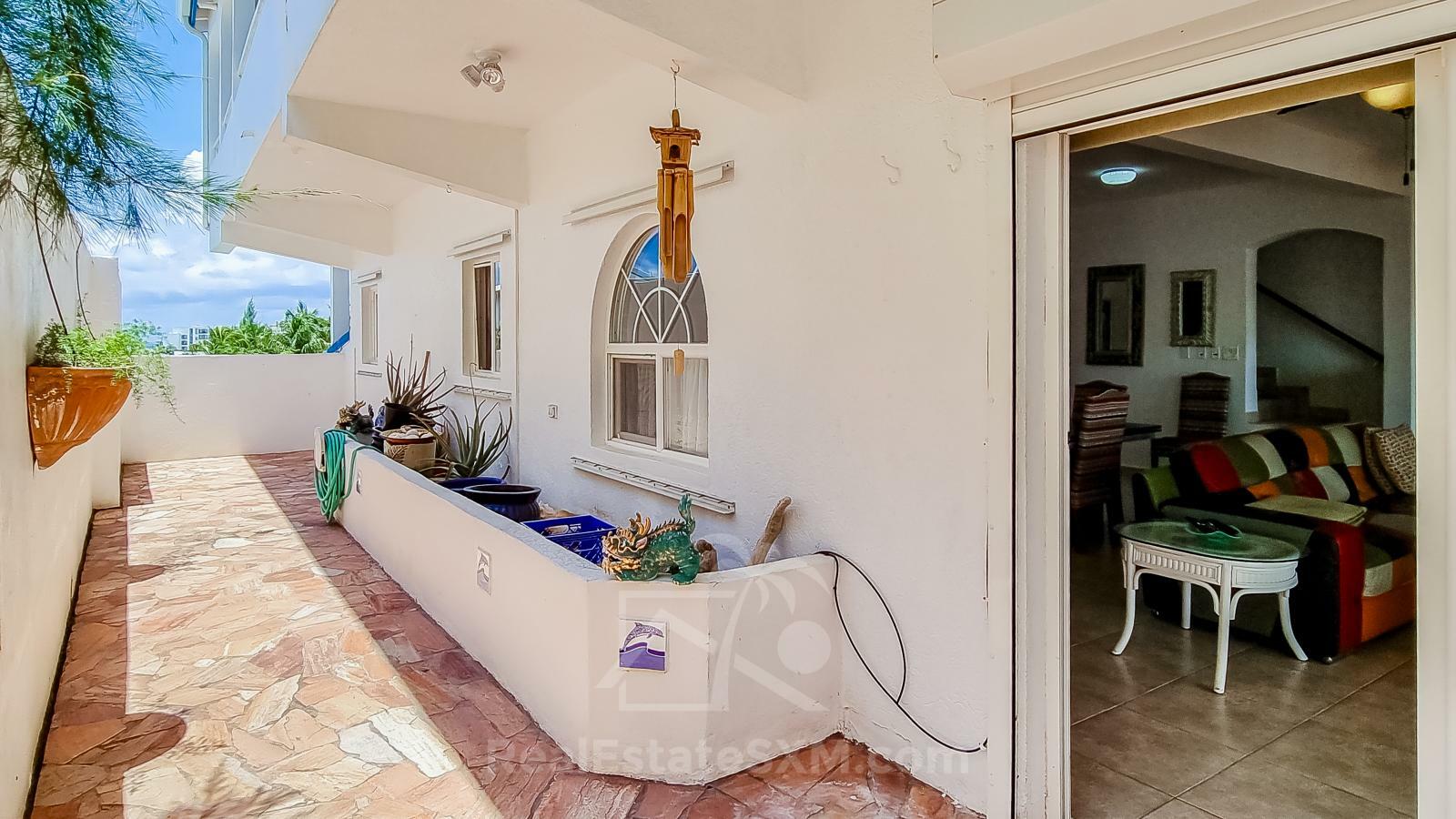 Waterfront Caribbean Villa for sale St Maarten, Beacon Hill. 2 bedrooms + Studio. Beach view. Boats