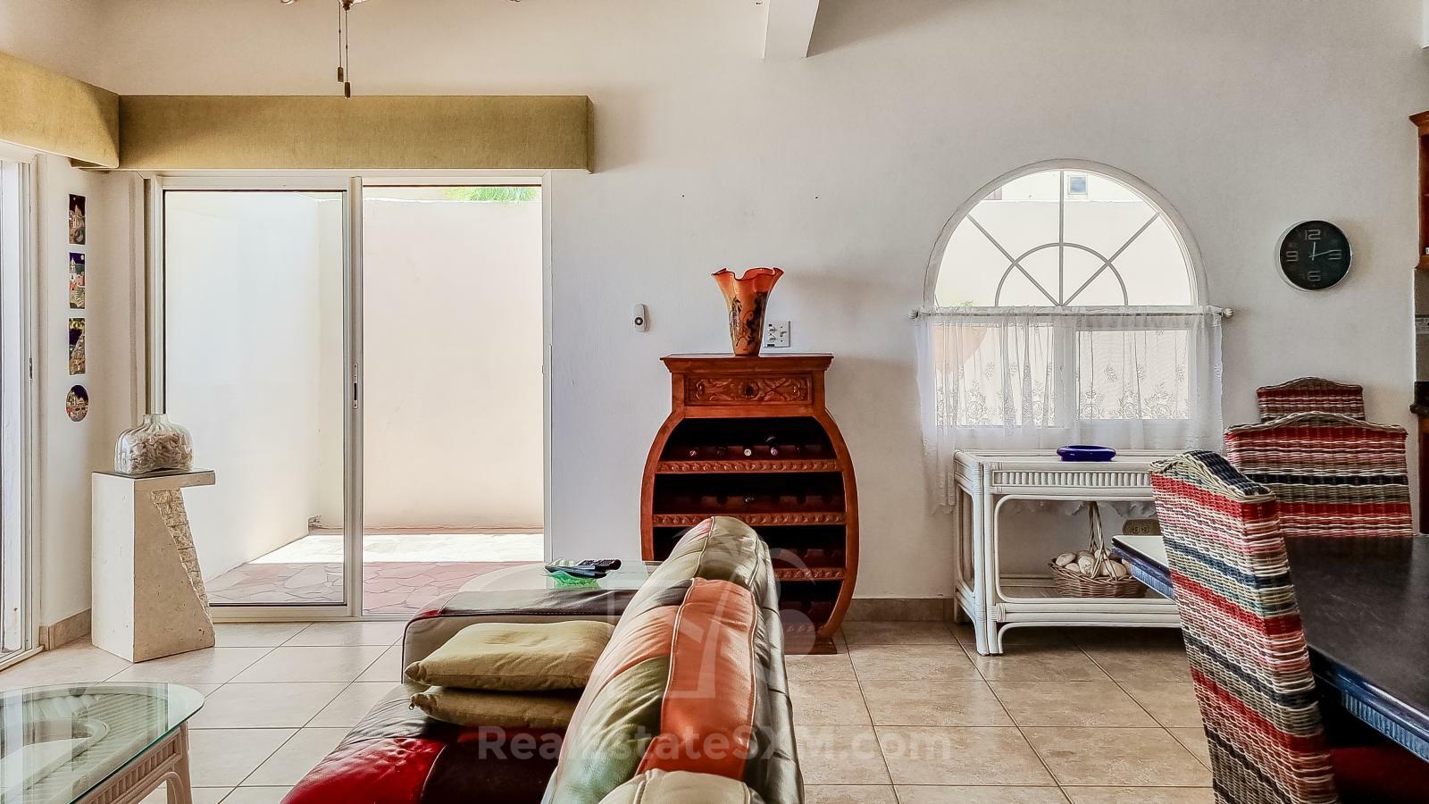 Waterfront Caribbean Villa for sale St Maarten, Beacon Hill. 2 bedrooms + Studio. Beach view. Boats