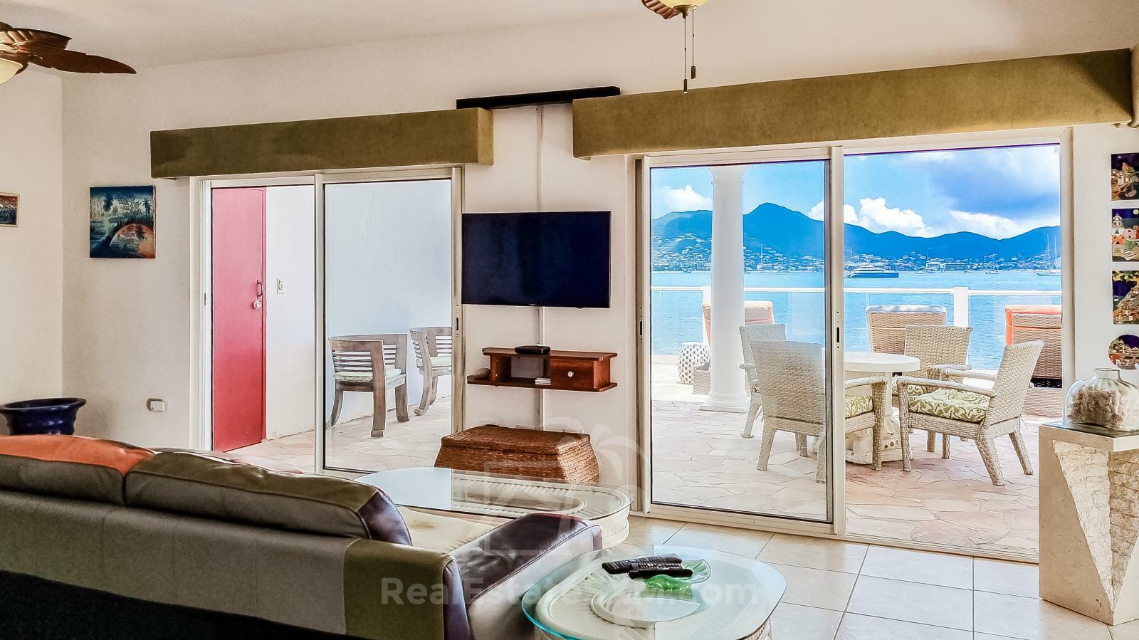 Waterfront Caribbean Villa for sale St Maarten, Beacon Hill. 2 bedrooms + Studio. Beach view. Boats