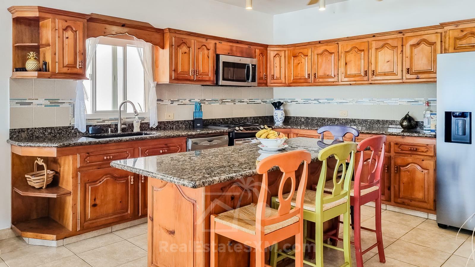 Waterfront Caribbean Villa for sale St Maarten, Beacon Hill. 2 bedrooms + Studio. Beach view. Boats