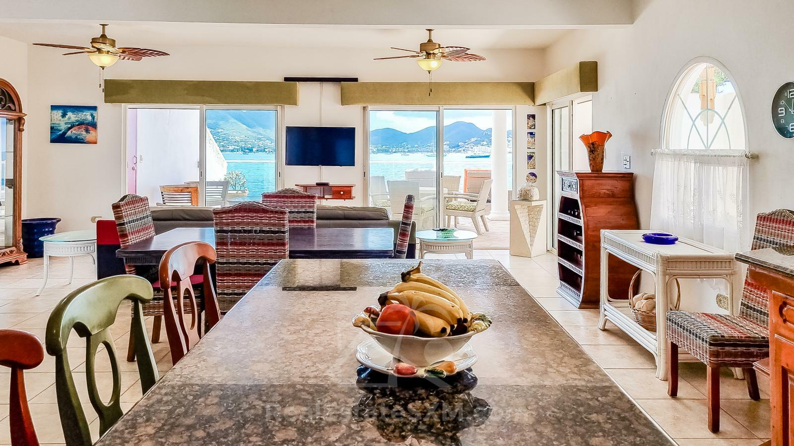 Waterfront Caribbean Villa for sale St Maarten, Beacon Hill. 2 bedrooms + Studio. Beach view. Boats