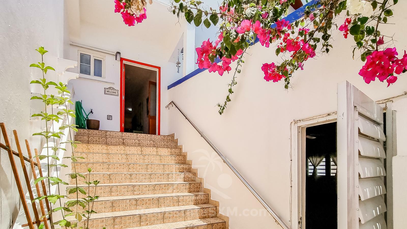 Waterfront Caribbean Villa for sale St Maarten, Beacon Hill. 2 bedrooms + Studio. Beach view. Boats