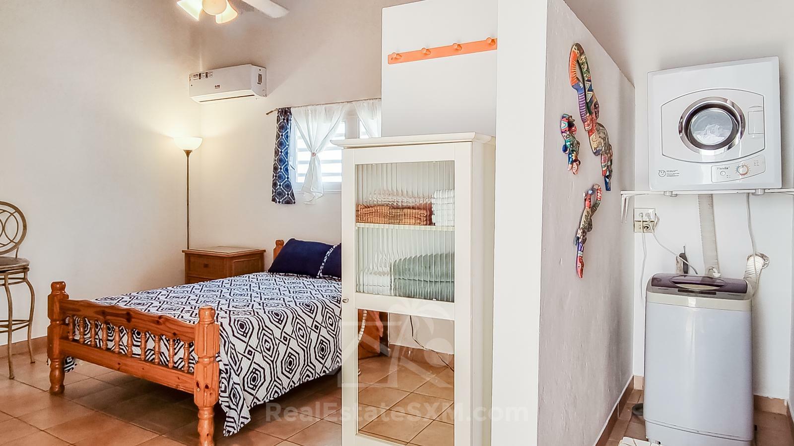 Waterfront Caribbean Villa for sale St Maarten, Beacon Hill. 2 bedrooms + Studio. Beach view. Boats