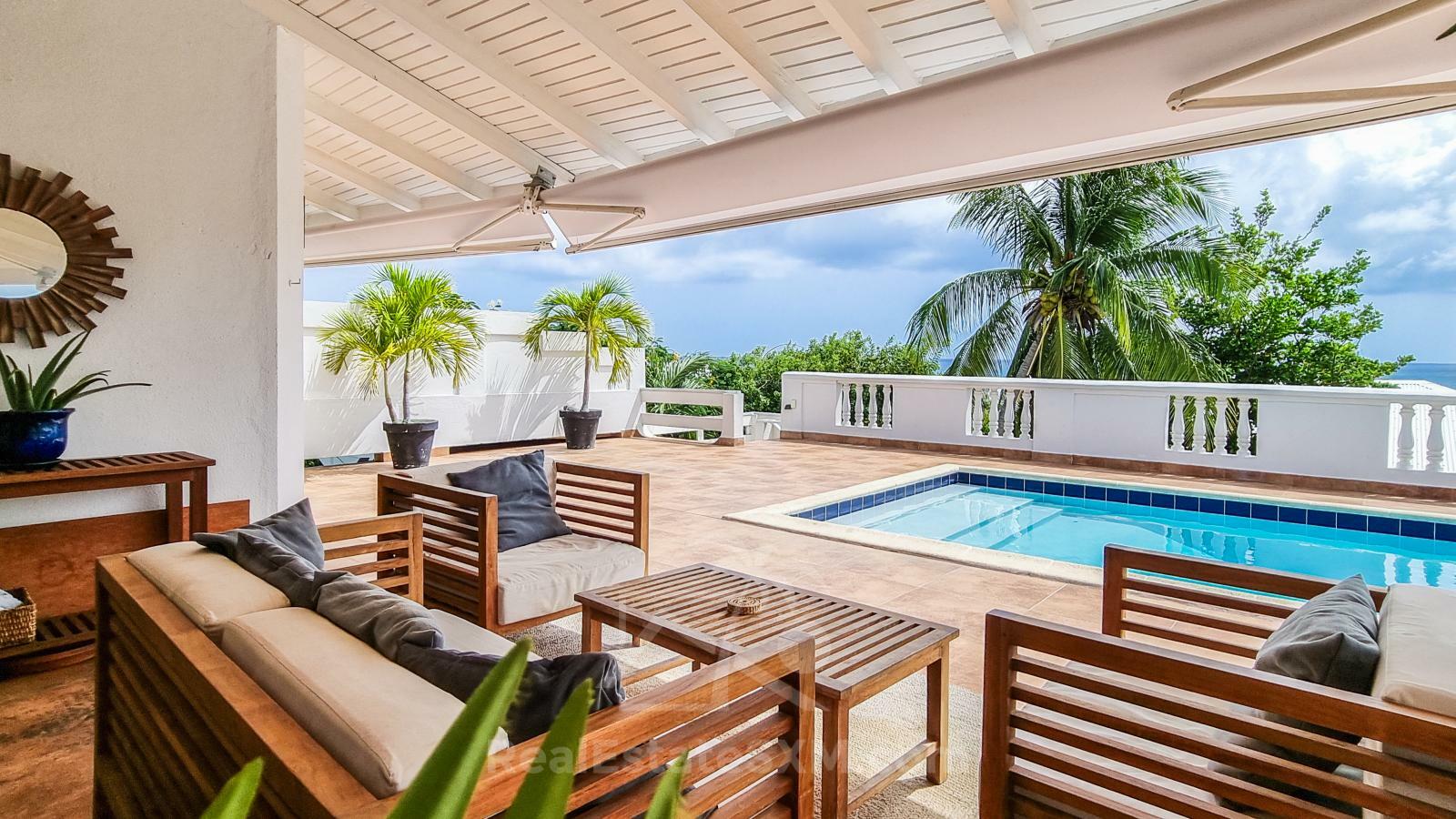 Caribbean Villa Domila for sale in St Maarten, Pelican Key. Ocean view & Sunsets. Rental income