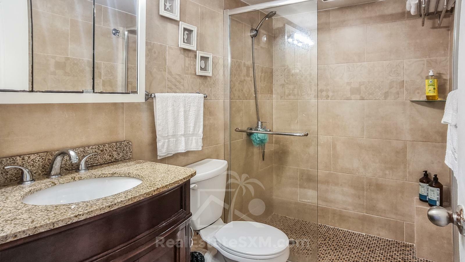St Maarten home FOR SALE 2-bedroom condo Ocean-Front in Point Blanche. Swimming Pool. 