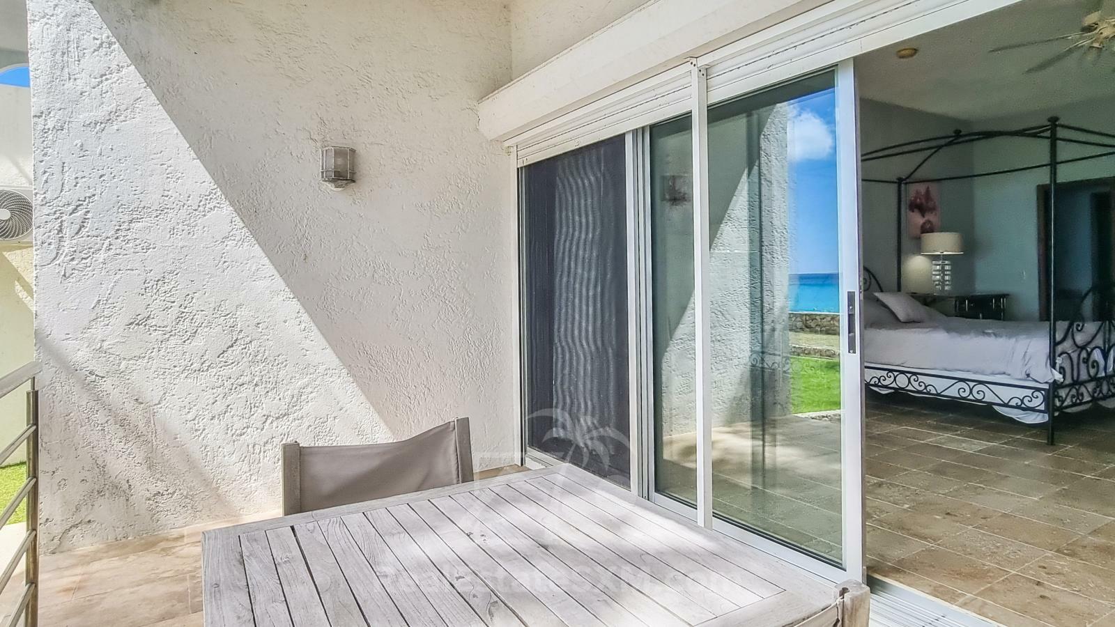 Waterfront condo in St Maarten Cupecoy Beach Club For Sale. Caribbean Sunsets. Private Beach. Gated