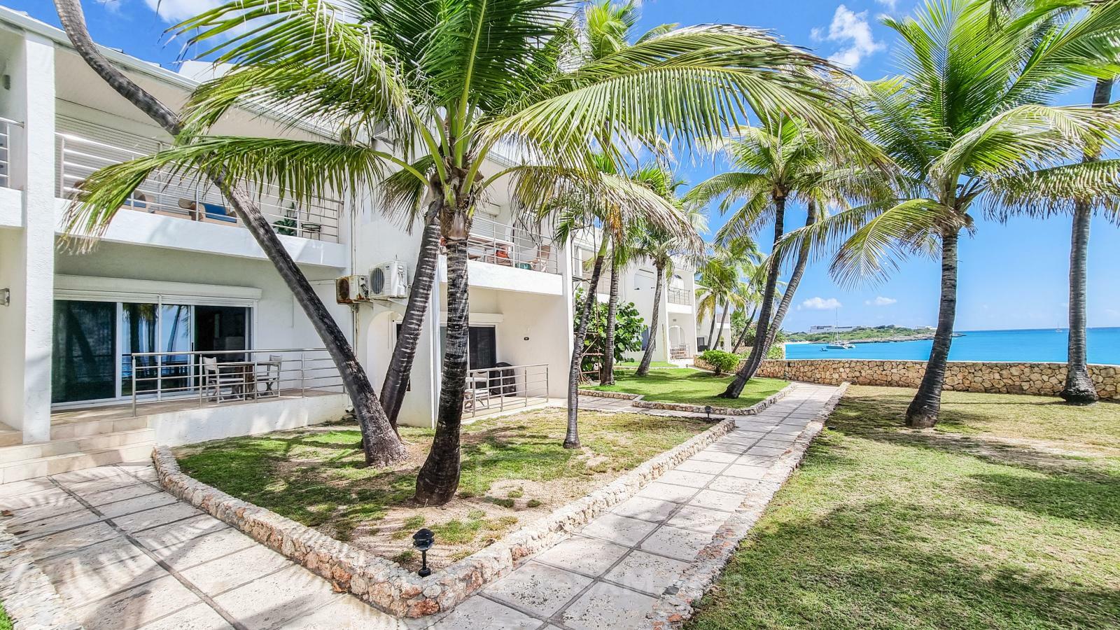 Waterfront condo in St Maarten Cupecoy Beach Club For Sale. Caribbean Sunsets. Private Beach. Gated
