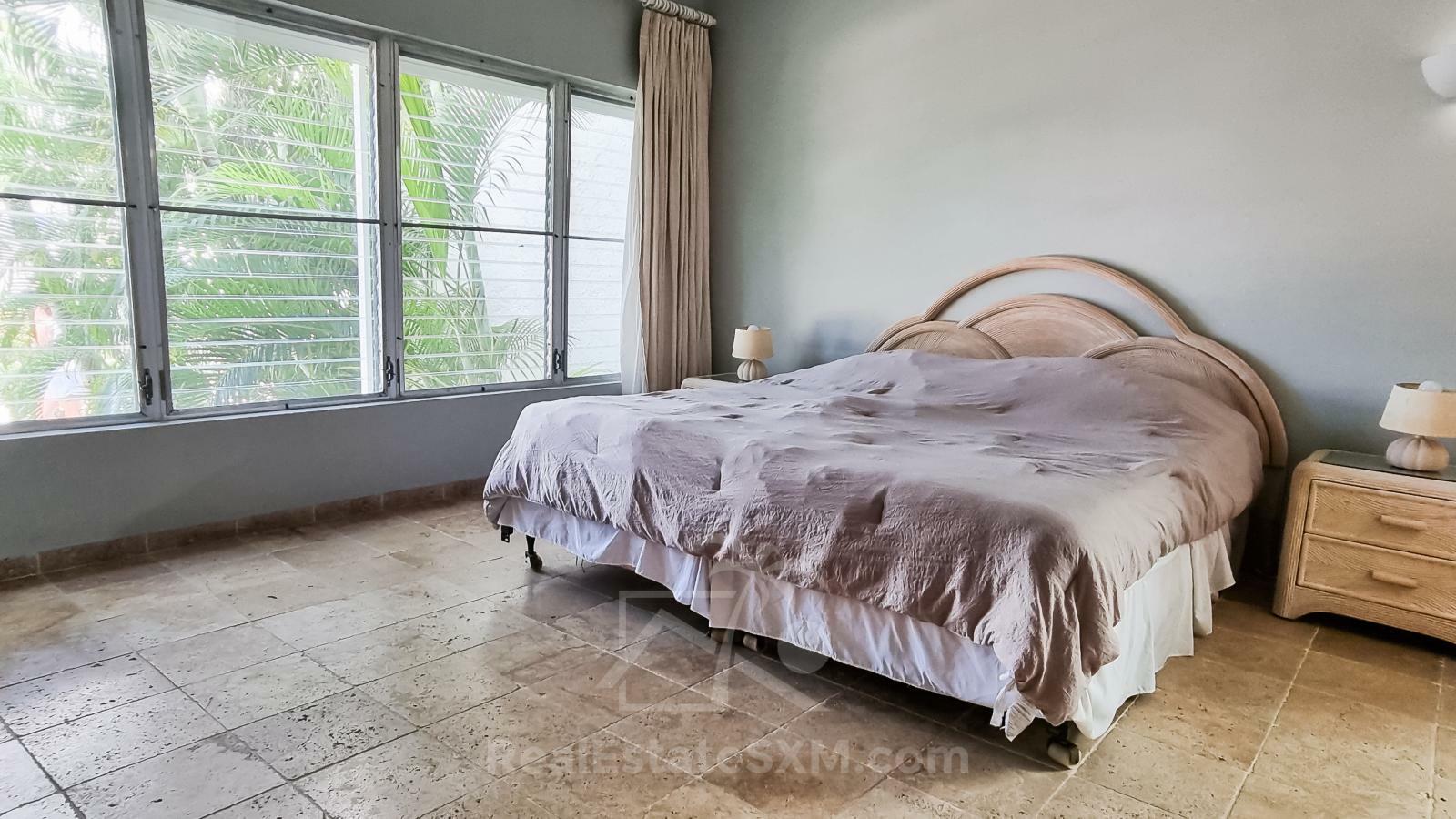 Waterfront condo in St Maarten Cupecoy Beach Club For Sale. Caribbean Sunsets. Private Beach. Gated