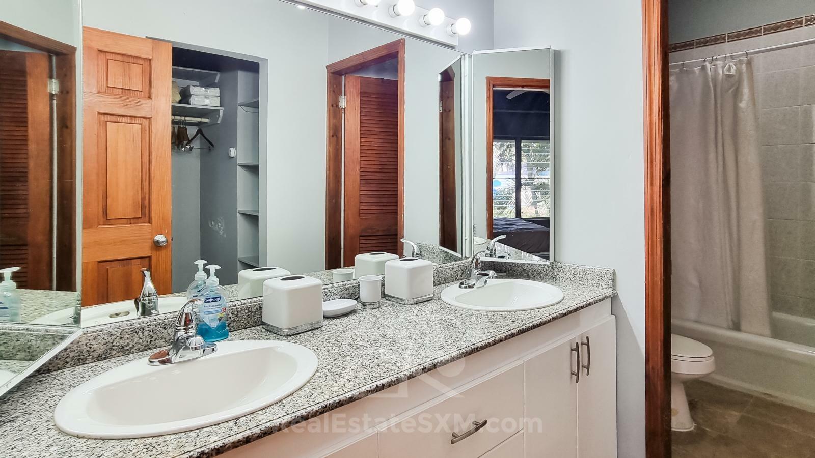 Waterfront condo in St Maarten Cupecoy Beach Club For Sale. Caribbean Sunsets. Private Beach. Gated