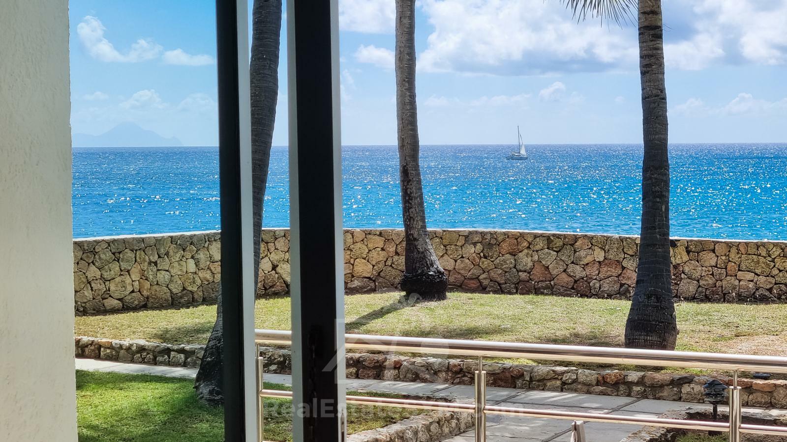 Waterfront condo in St Maarten Cupecoy Beach Club For Sale. Caribbean Sunsets. Private Beach. Gated