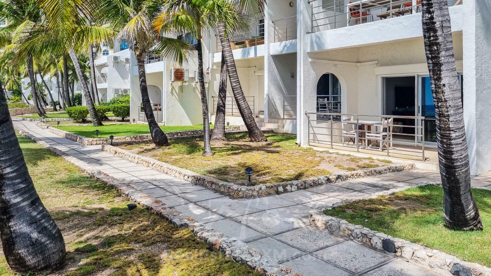 Waterfront condo in St Maarten Cupecoy Beach Club For Sale. Caribbean Sunsets. Private Beach. Gated