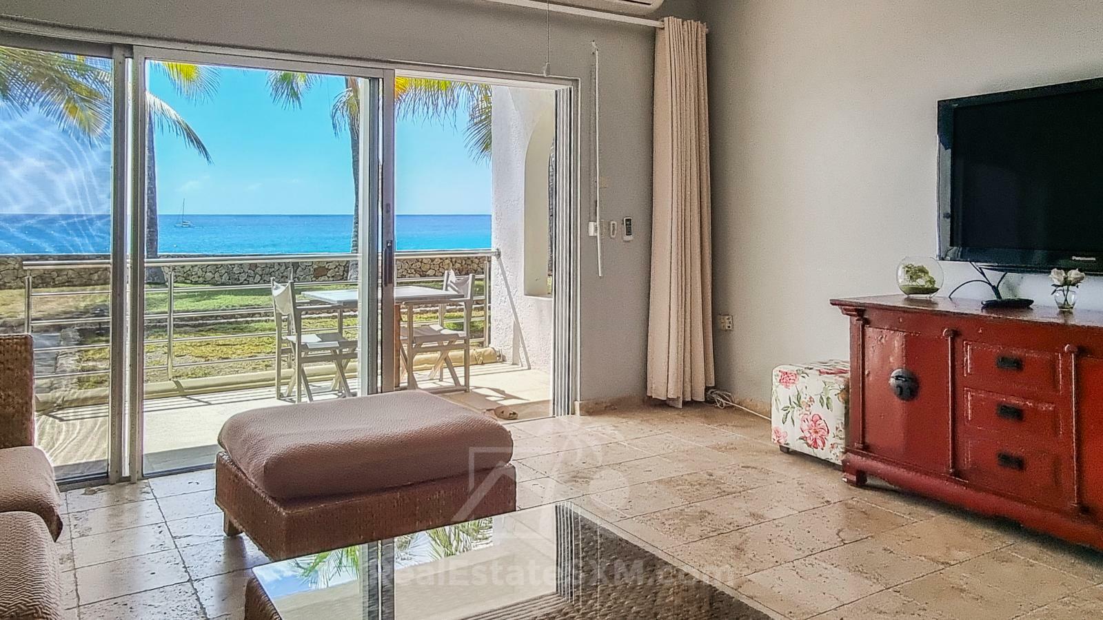 Waterfront condo in St Maarten Cupecoy Beach Club For Sale. Caribbean Sunsets. Private Beach. Gated
