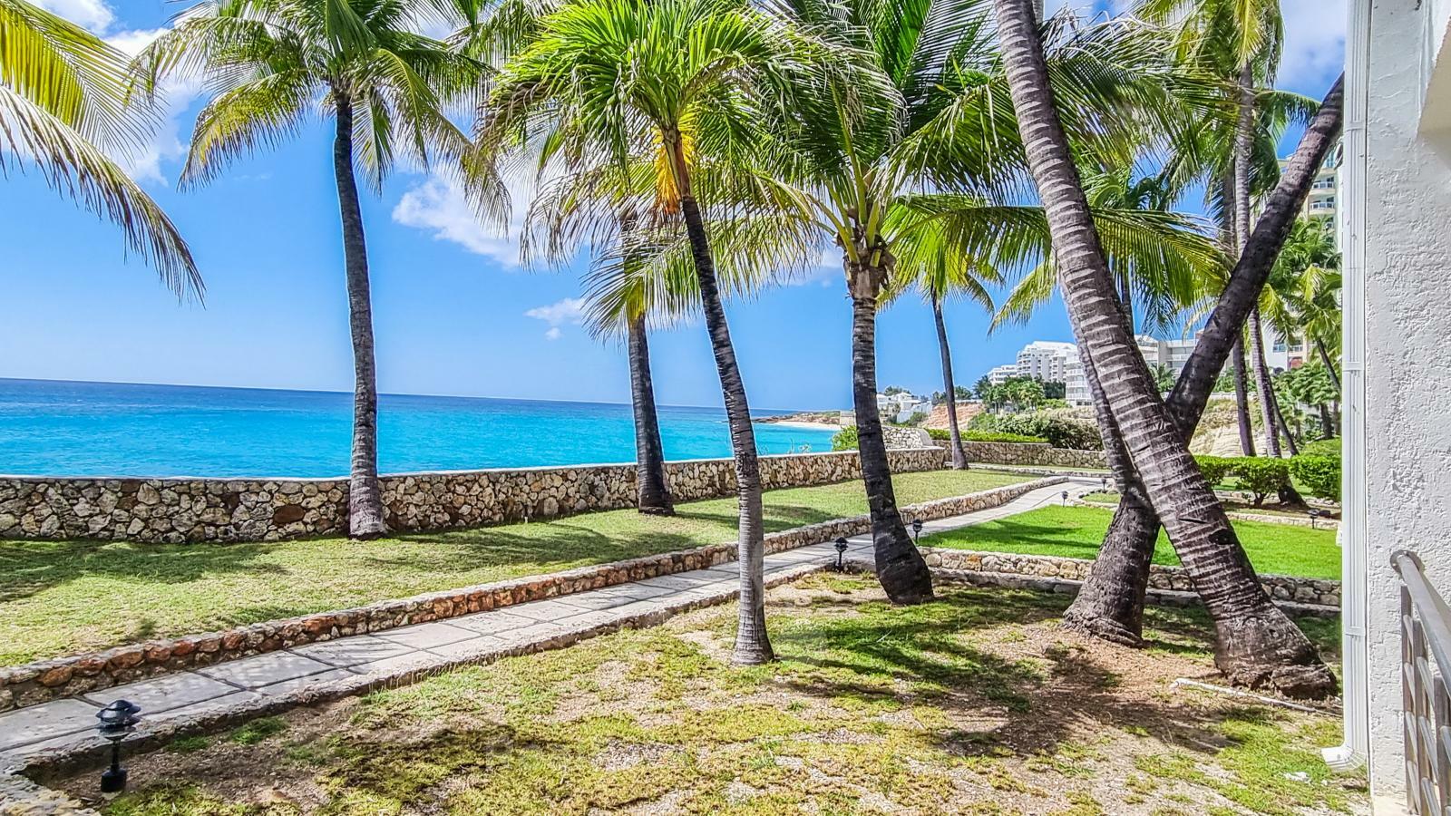 Waterfront condo in St Maarten Cupecoy Beach Club For Sale. Caribbean Sunsets. Private Beach. Gated