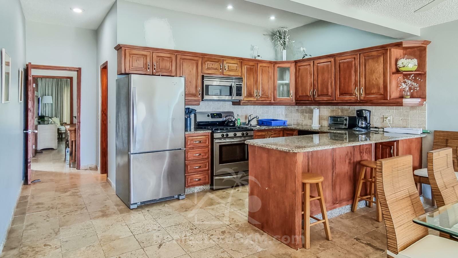 Waterfront condo in St Maarten Cupecoy Beach Club For Sale. Caribbean Sunsets. Private Beach. Gated
