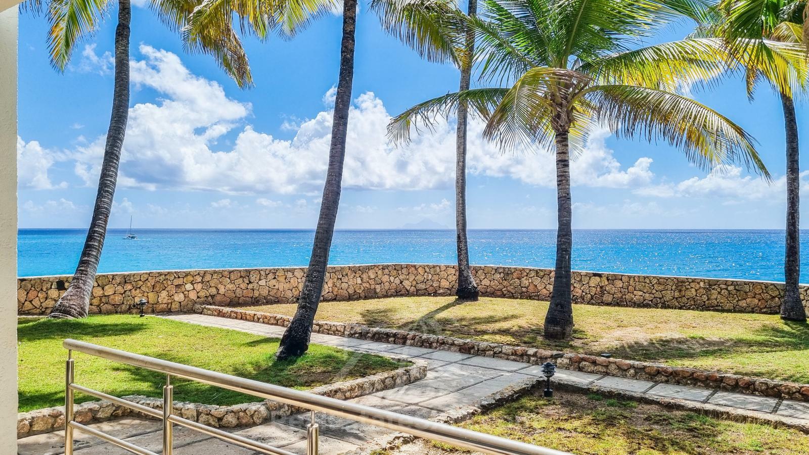 Waterfront condo in St Maarten Cupecoy Beach Club For Sale. Caribbean Sunsets. Private Beach. Gated