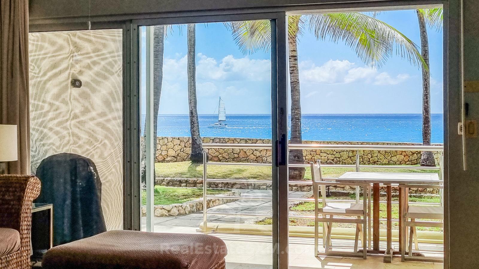 Waterfront condo in St Maarten Cupecoy Beach Club For Sale. Caribbean Sunsets. Private Beach. Gated