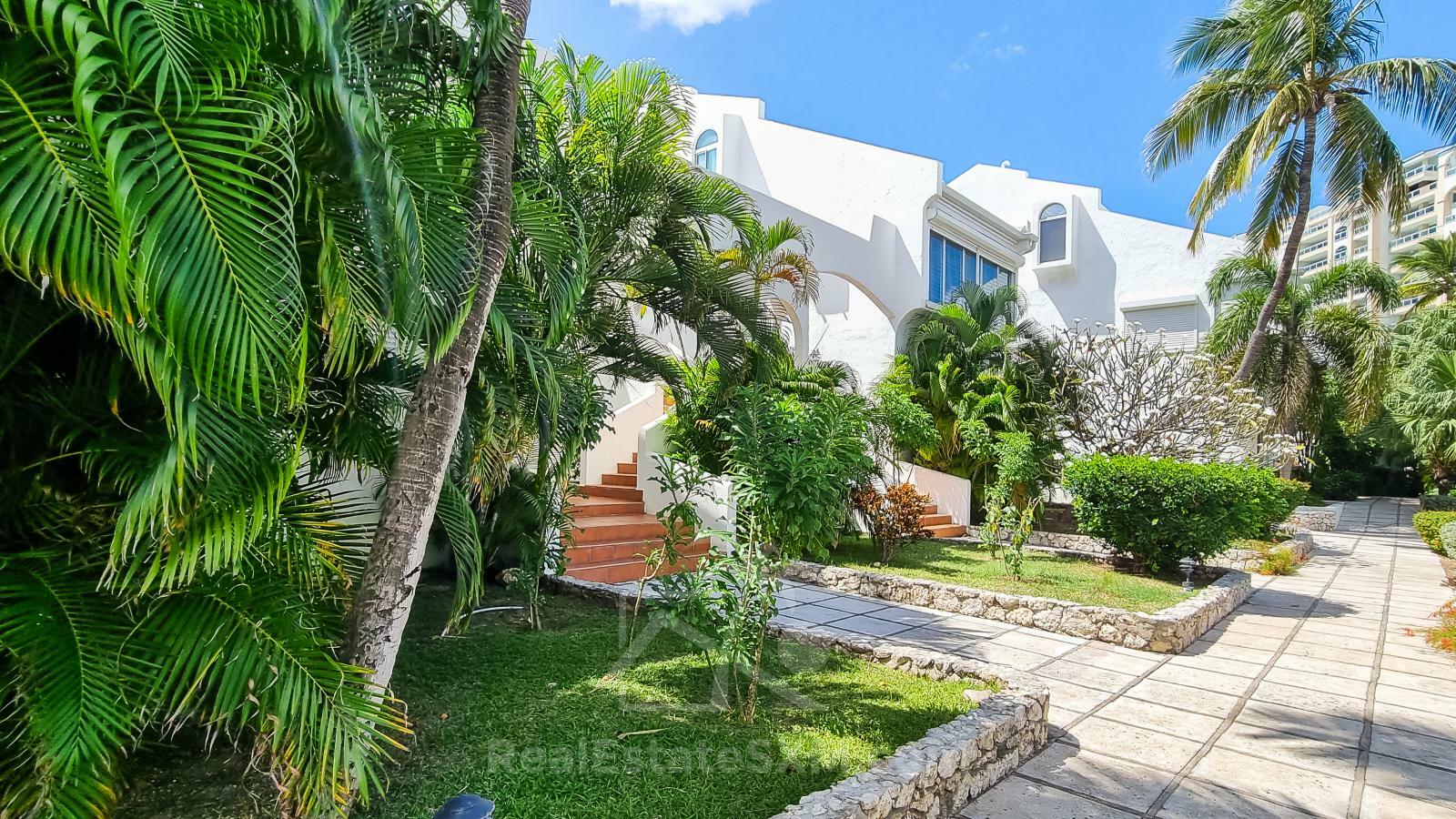 Waterfront condo in St Maarten Cupecoy Beach Club For Sale. Caribbean Sunsets. Private Beach. Gated