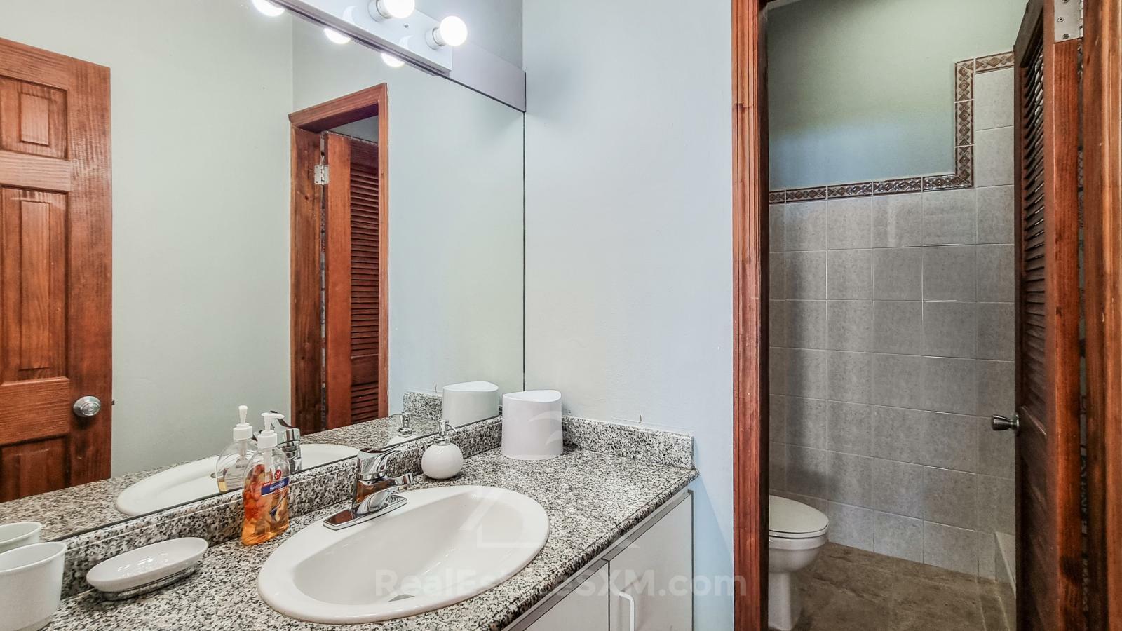 Waterfront condo in St Maarten Cupecoy Beach Club For Sale. Caribbean Sunsets. Private Beach. Gated