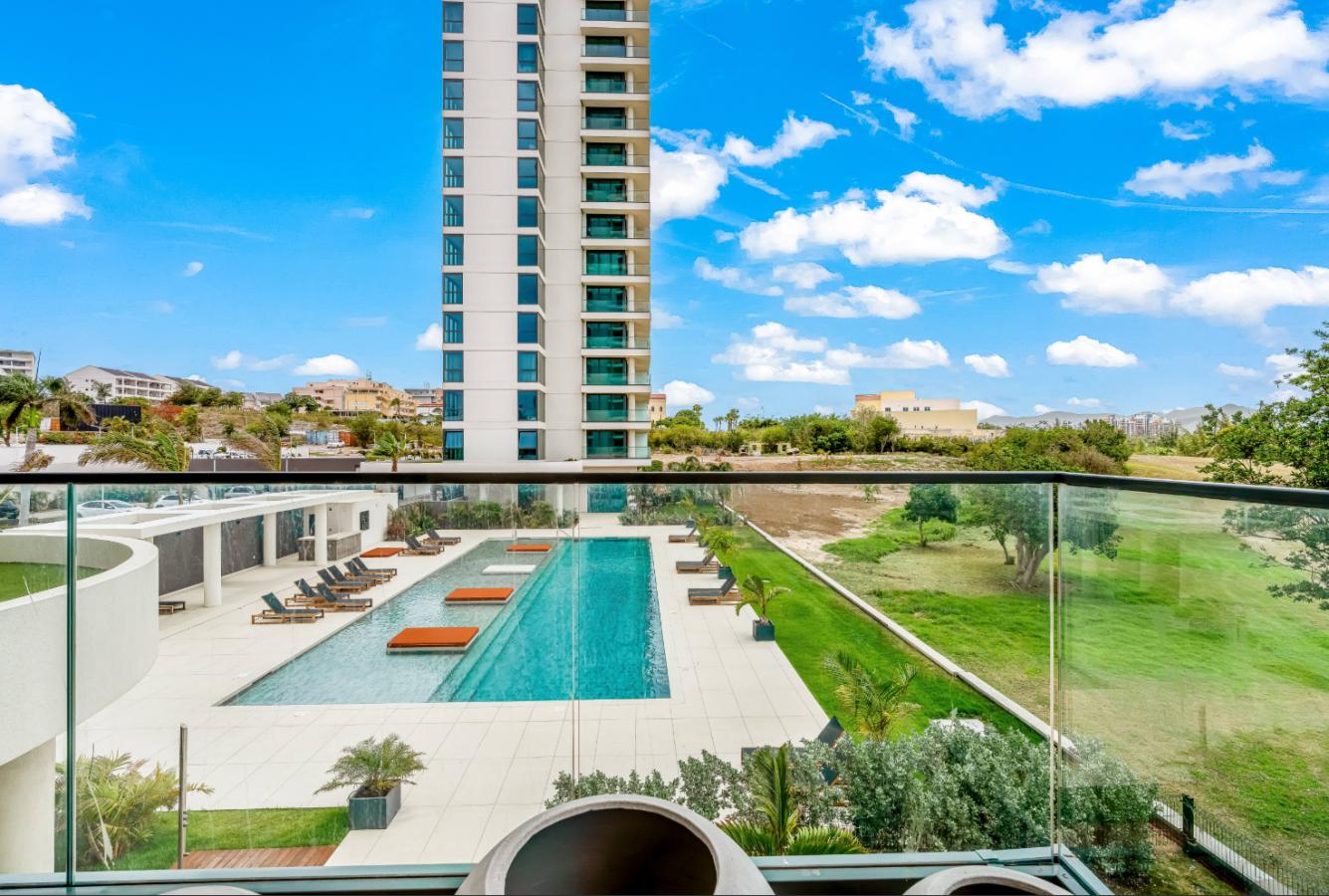 Fourteen 1BR Condo at Mullet Bay Beach for sale. Corner bedroom unit, ground floor convinience A104