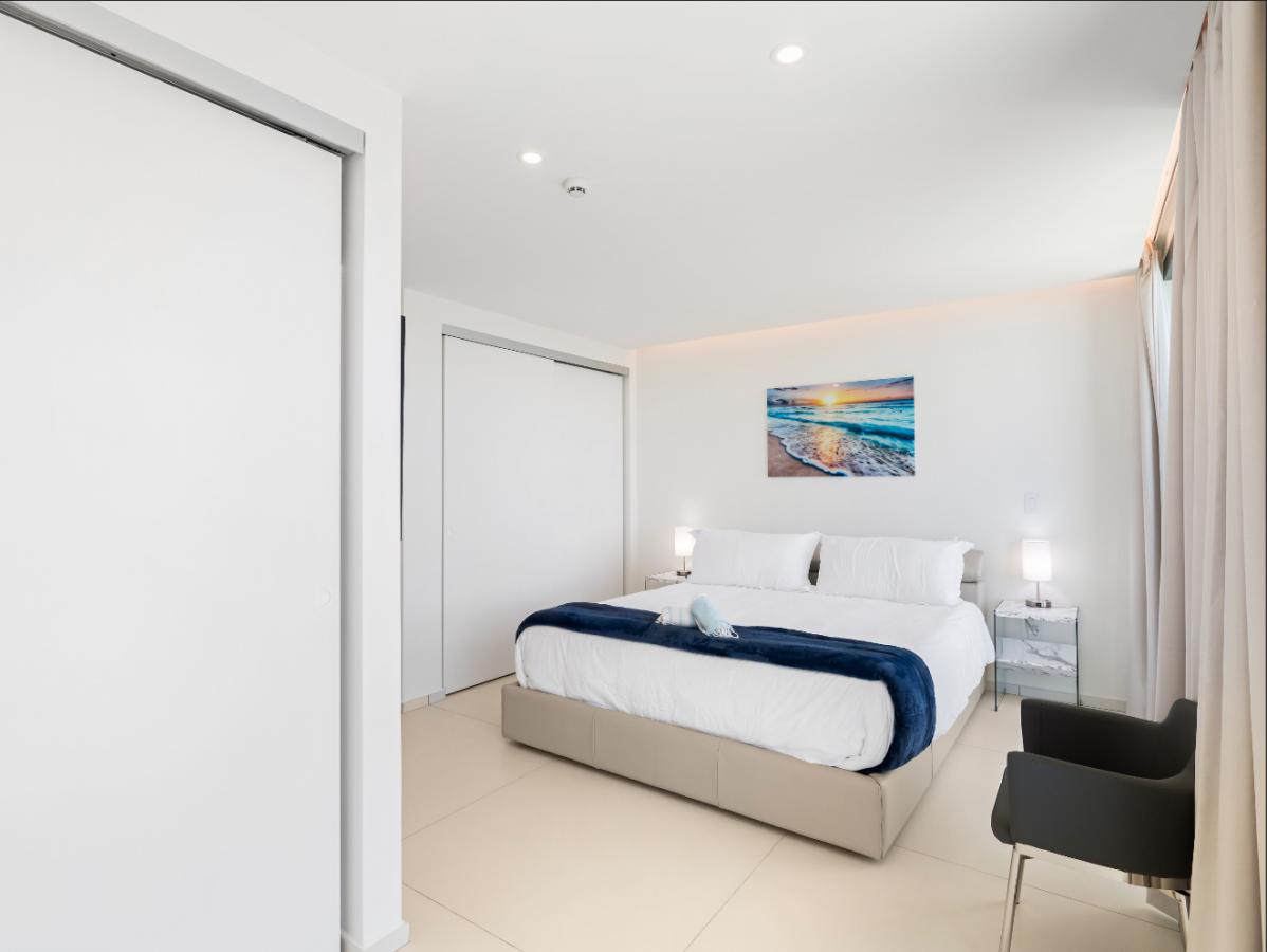 St Maarten real estate: Fourteen Mullet Bay Sub-penthouse ocean view height ceiling 19th floor B1901