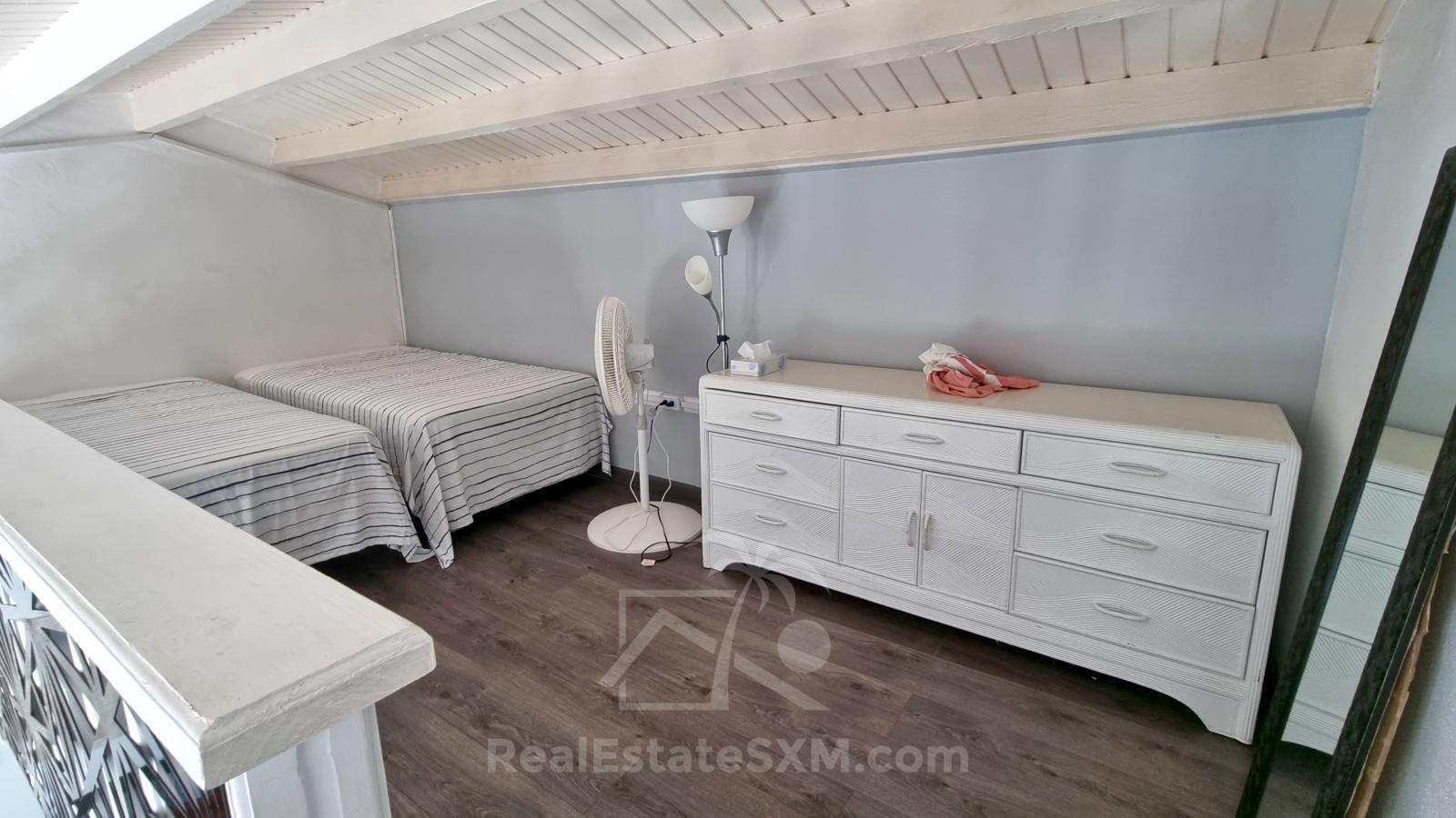 Rare Opportunity: Two Side-by-Side 1BR Condos with mezzanine at Tamarind Apartments, Point Blanche